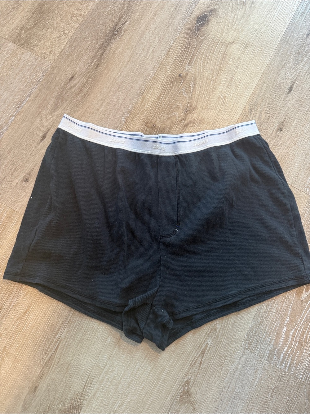 SKIMS Black Lounge Sleep Shorts with White Elastic Waistband